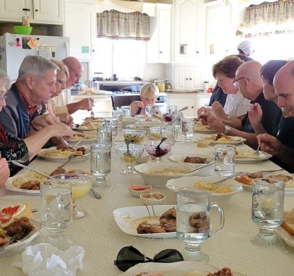 A group of tourists enjoy a home-cooked Amish meal.